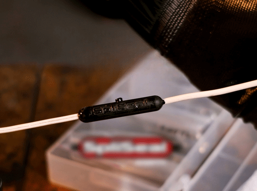 A real crimped wire splice sealed weatherproof inside the red SpliSeal mold