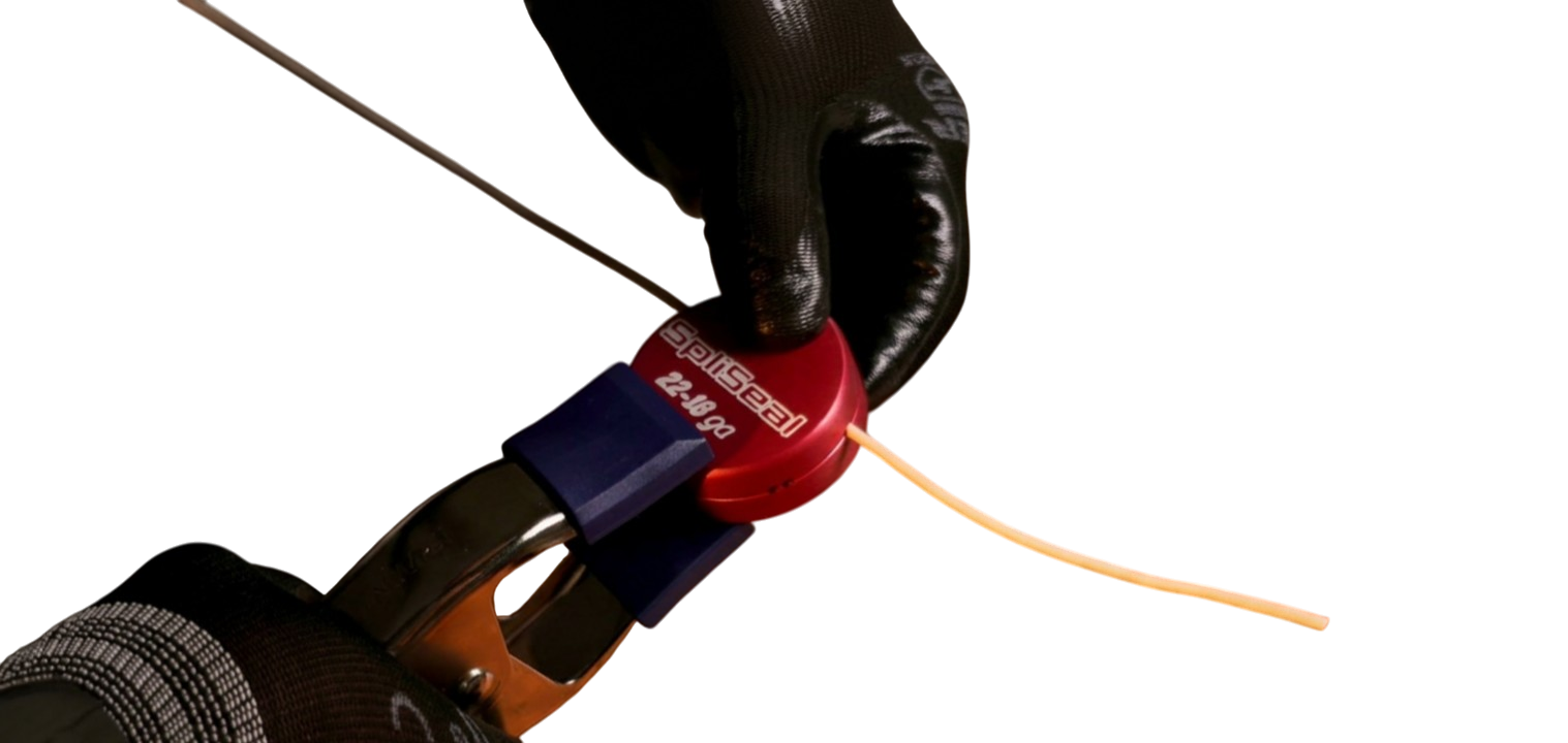 A crimped wire splice loaded into the open SpliSeal mold