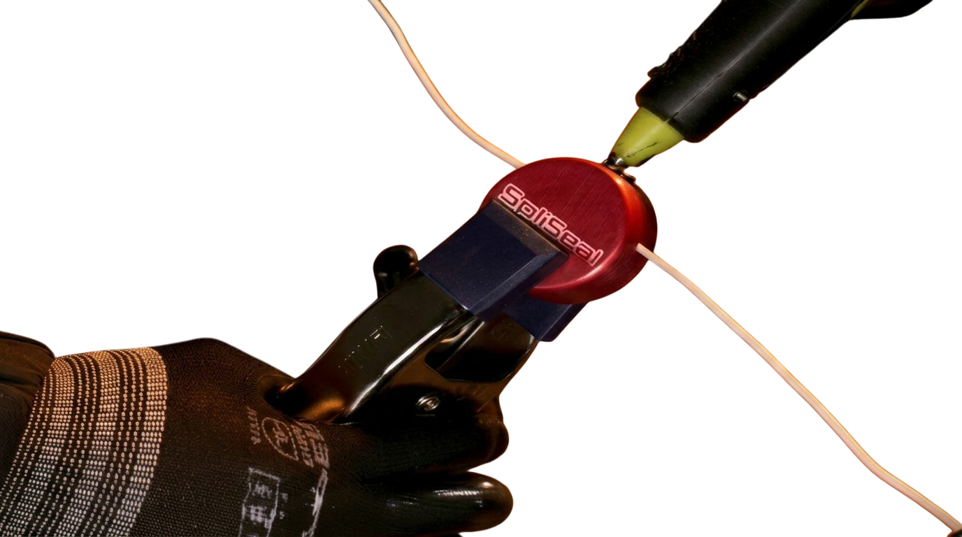 The SpliSeal mold closed and sealed around the wire, splice encased